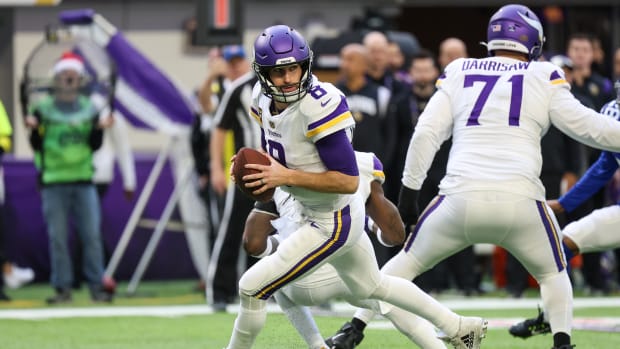 Dec 24, 2022; Minneapolis, Minnesota, USA; Minnesota Vikings quarterback Kirk Cousins (8) drops to pass against the New York Giants during the first quarter at U.S. Bank Stadium.